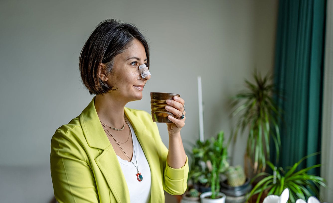 woman recovering from her rhinoplasty in Anchorage, AK